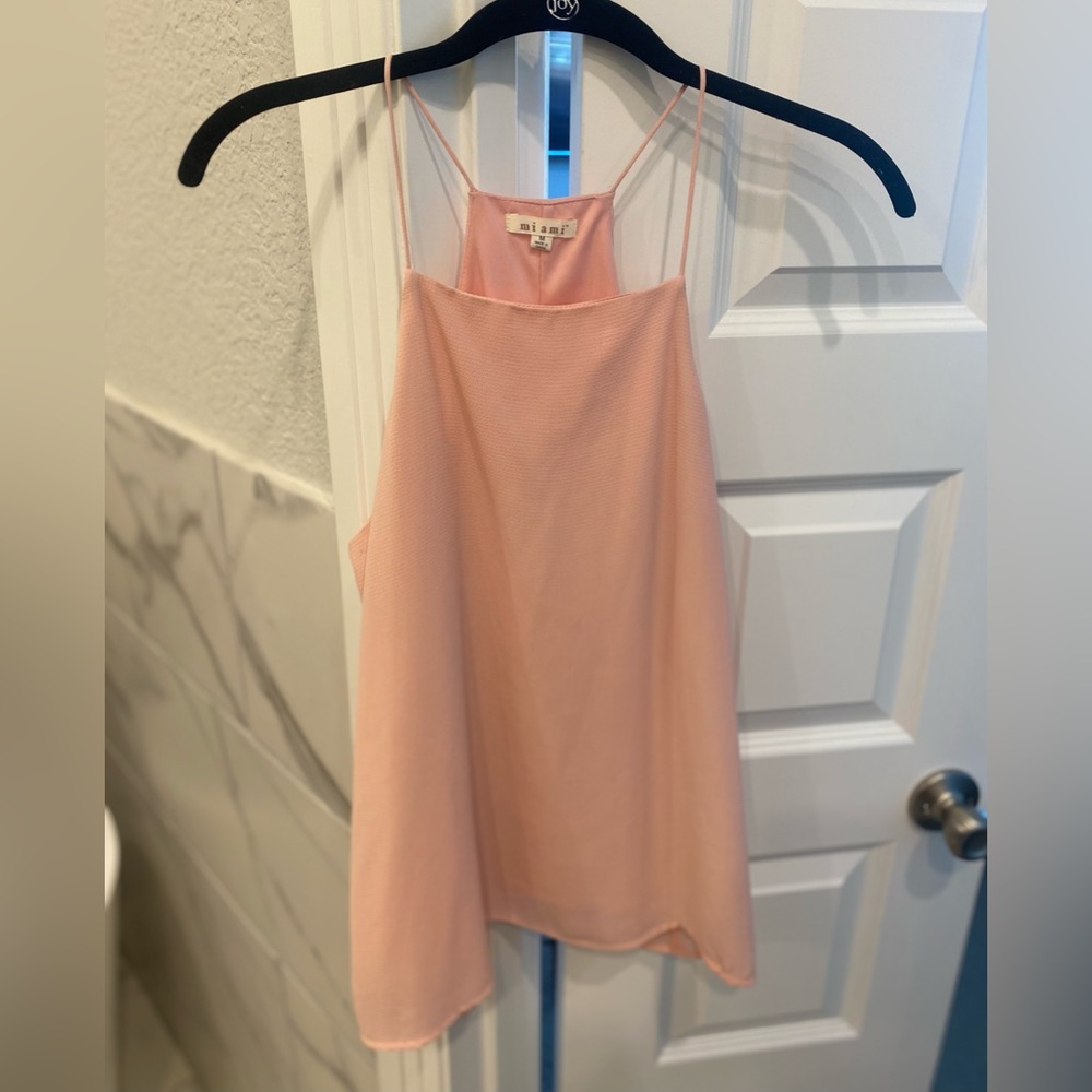 Medium. Soft pink tank.